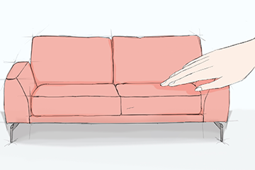 Rosafarbenes Sofa, das von einer großen Hand angefasst wird